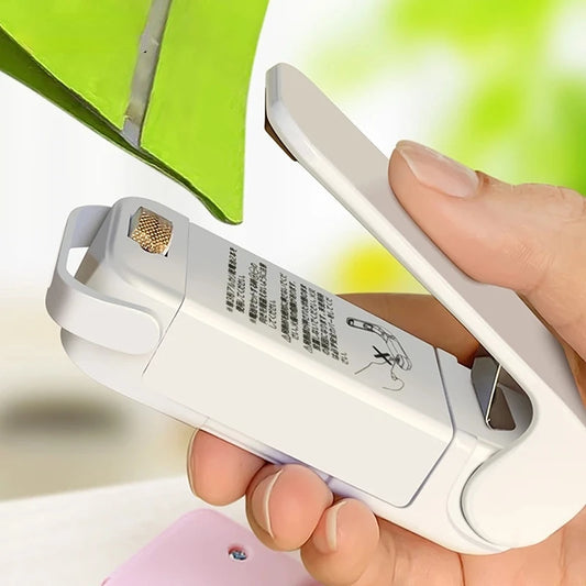 Mini seladora de sacos térmicos para alimentos.